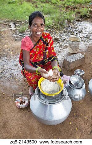 Tribal women selling traditional rice beer, Hadia. Munda tribe. Bartoli village, Khunti District Ranchi, Jharkhand, India. View Large Photo Image Stock Image - Tribal women selling traditional rice beer, Hadia. Munda tribe. Bartoli village, Khunti District Ranchi, Jharkhand, India.. Fotosearch