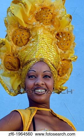 Trinidad Cuba dancer in show costume gold against blue wall and colorful head dress and smile. View Large Photo Image Stock Image - Trinidad Cuba dancer in show costume gold against blue wall and colorful head dress and smile.. Fotosearch