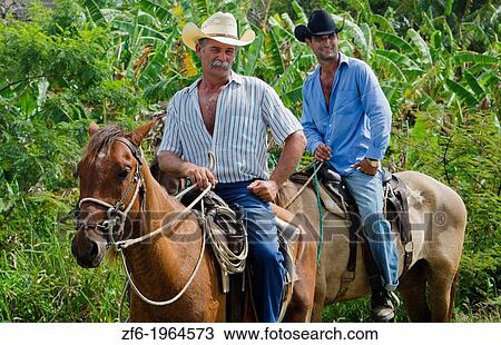 Trinidad Cuba real cowboys on horses riding on road portrait from ranch. View Large Photo Image Stock Image - Trinidad Cuba real cowboys on horses riding on road portrait from ranch.. Fotosearch