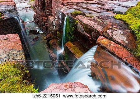 Stock Image - Triple Falls, Glacier National Park, Montana USA.. Fotosearch