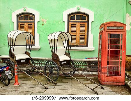 trishaws and phone booth at the Pinang Peranakan Mansion in Georgetown, Penang, Malaysia. View Large Photo Image Stock Photo - trishaws and phone booth at the Pinang Peranakan Mansion in Georgetown, Penang, Malaysia.. Fotosearch