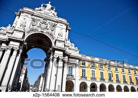 Triumphal Arch on Pra? a do comercio, commerce square, near Tajus river, Baixa district, Lisbon, Portugal, Europe View Large Photo Image Stock Photo - Triumphal Arch on Pra? a do comercio, commerce square, near Tajus river, Baixa district, Lisbon, Portugal, Europe. Fotosearch