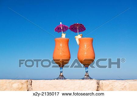 Tropical cotail beverages at a island resort. View Large Photo Image Stock Photo - Tropical cotail beverages at a island resort.. Fotosearch
