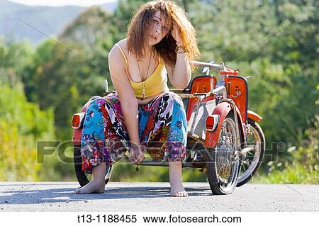 Troubles with a flat tire View Large Photo Image Stock Photography - Troubles with a flat tire. Fotosearch