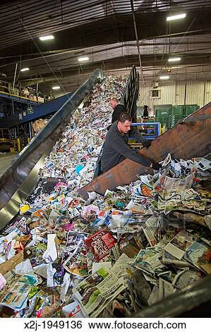 Troy, Michigan - Workers sort paper, glass, plastic, and metals for recycling at the Southeastern Oakland County Resource Recovery Authority. The materials are picked up in curbside recycling bins at homes in 12 suburban Detroit communities. View Large Photo Image Stock Photograph - Troy, Michigan - Workers sort paper, glass, plastic, and metals for recycling at the Southeastern Oakland County Resource Recovery Authority. The materials are picked up in curbside recycling bins at homes in 12 suburban Detroit communities.. Fotosearch