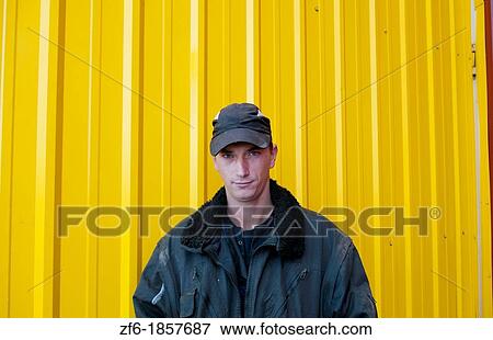 Trucker portrait Lithuania improvements industry farming with colorful company of wheat farming storage area with trucks in Vaunas Lithuania View Large Photo Image Stock Photo - Trucker portrait Lithuania improvements industry farming with colorful company of wheat farming storage area with trucks in Vaunas Lithuania. Fotosearch