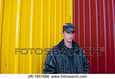 Trucker portrait Lithuania improvements industry farming with colorful company of wheat farming storage area with trucks in Vaunas Lithuania View Large Photo Image Stock Photograph - Trucker portrait Lithuania improvements industry farming with colorful company of wheat farming storage area with trucks in Vaunas Lithuania. Fotosearch
