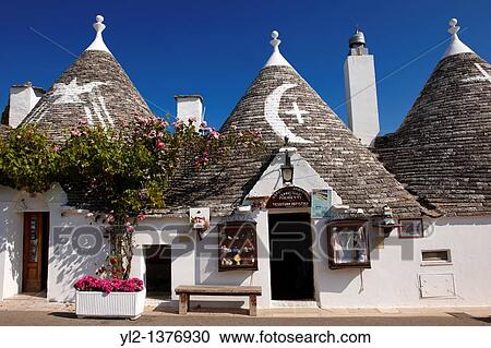 Stock Image - Trulli houses of the Rione Monti Area of Alberobello, Puglia, Italy. Fotosearch