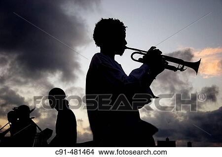 Trumpet player in El Malec? n in the evening. Havana. Cuba View Large Photo Image Picture - Trumpet player in El Malec? n in the evening. Havana. Cuba. Fotosearch