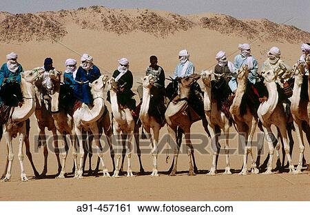 Tuareg camel race for the Sebiba festival. Djanet. Tassili N? Ajjer. Sahara. Algeria. View Large Photo Image Stock Image - Tuareg camel race for the Sebiba festival. Djanet. Tassili N? Ajjer. Sahara. Algeria.. Fotosearch