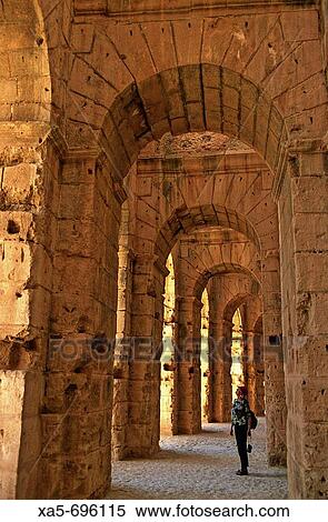 Tunisia, Eljem, Roman Colesium, tourist admiring the interior vaults View Large Photo Image Stock Photography - Tunisia, Eljem, Roman Colesium, tourist admiring the interior vaults. Fotosearch