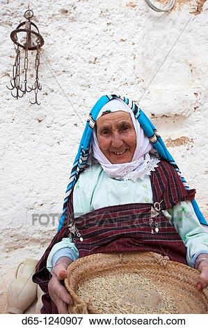 Tunisia, Ksour Area, Matmata, older Berber woman with grain, R, MR-TUN-10-008 View Large Photo Image Stock Photo - Tunisia, Ksour Area, Matmata, older Berber woman with grain, R, MR-TUN-10-008. Fotosearch