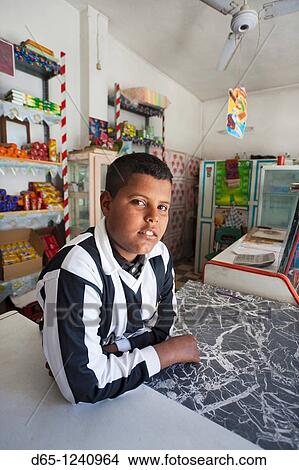 Tunisia, Sahara Desert, Douz, young Tunisian shop keeper, R, MR-TUN-10-010 View Large Photo Image Picture - Tunisia, Sahara Desert, Douz, young Tunisian shop keeper, R, MR-TUN-10-010. Fotosearch