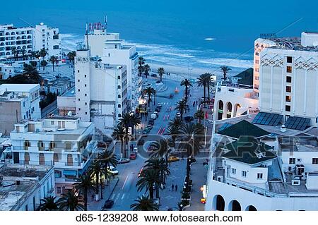 Tunisia, Tunisian Central Coast, Sousse, elevated view of Avenue Habib Bourguiba towards Boujaffar Beach, dusk View Large Photo Image Stock Photo - Tunisia, Tunisian Central Coast, Sousse, elevated view of Avenue Habib Bourguiba towards Boujaffar Beach, dusk. Fotosearch