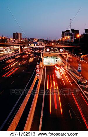 Stock Image - Tunnel in M-30 motorway, night view Madrid, Spain. Fotosearch