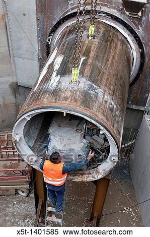 Stock Photography - Tunnelling a new underground sewerage pipe under Tel Aviv and the Dan region in Israel The heavy duty drill bit is being removed at the end of the tunnel. Fotosearch