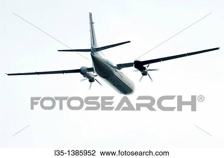 Turboprop aircraft in bright sky View Large Photo Image Stock Image - Turboprop aircraft in bright sky. Fotosearch