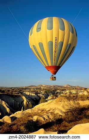 TURKEY, CAPPADOCIA, ROCK FORMATIONS NEAR UCHISAR, HOT AIR BALLOON. View Large Photo Image Stock Photo - TURKEY, CAPPADOCIA, ROCK FORMATIONS NEAR UCHISAR, HOT AIR BALLOON.. Fotosearch