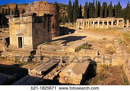 Turkey- Hierapolis Greek: ep? sacred city? was an ancient Greco-Roman city in Phrygia located on hot springs in southwest Anatolia Its ruins are adjacent to modern Pamukkale, Turkey View Large Photo Image Stock Image - Turkey- Hierapolis Greek: ep? sacred city? was an ancient Greco-Roman city in Phrygia located on hot springs in southwest Anatolia Its ruins are adjacent to modern Pamukkale, Turkey. Fotosearch