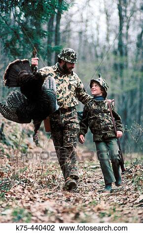 Stock Image - Turkey hunting, father and son. Fotosearch