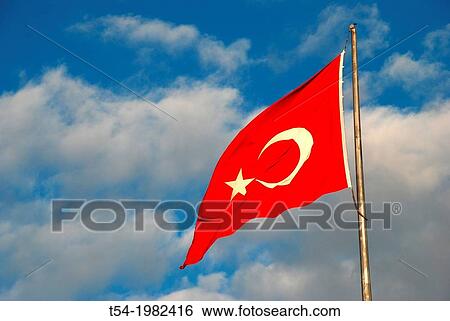 Turkish national flag blowing in the wind View Large Photo Image Stock Photograph - Turkish national flag blowing in the wind. Fotosearch