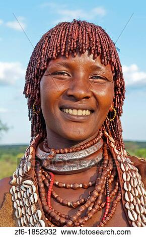 Turmi Ethiopia Africa village Lower Omo Valley Hamar Hammer tribe portrait of woman in village at sunset with First Wife necklace 24 View Large Photo Image Stock Image - Turmi Ethiopia Africa village Lower Omo Valley Hamar Hammer tribe portrait of woman in village at sunset with First Wife necklace 24. Fotosearch