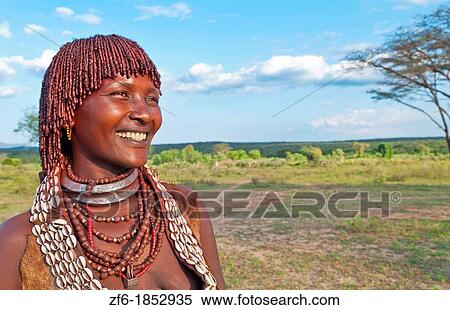 Turmi Ethiopia Africa village Lower Omo Valley Hamar Hammer tribe portrait of woman in village at sunset with First Wife necklace 24 View Large Photo Image Stock Photography - Turmi Ethiopia Africa village Lower Omo Valley Hamar Hammer tribe portrait of woman in village at sunset with First Wife necklace 24. Fotosearch