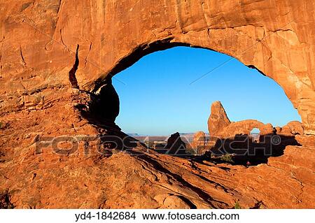 Turret Arch seen through North Window at sunrise, Arches National Park, Utah, USA View Large Photo Image Picture - Turret Arch seen through North Window at sunrise, Arches National Park, Utah, USA. Fotosearch