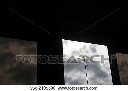 tv aerial on rooftop with dark sky View Large Photo Image Stock Image - tv aerial on rooftop with dark sky. Fotosearch