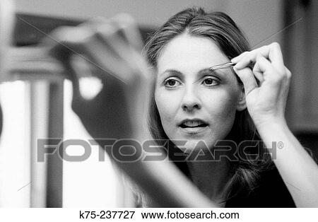 tweezing eyebrows View Large Photo Image Stock Photo - tweezing eyebrows. Fotosearch