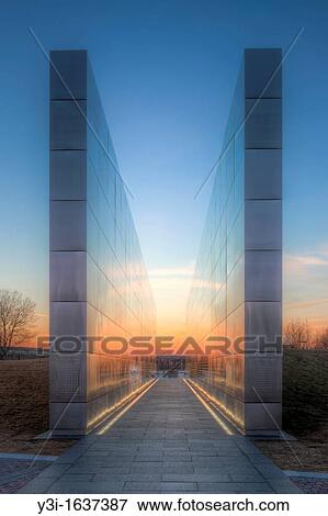 Twilight colors in the western sky provide a colorful background and reflections on the New Jersey 9/11 Empty Sky Memorial. View Large Photo Image Stock Photo - Twilight colors in the western sky provide a colorful background and reflections on the New Jersey 9/11 Empty Sky Memorial.. Fotosearch