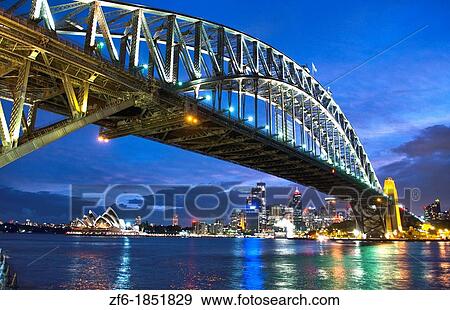 Twilight night exposure of color and great light of Famous Opera House and Harbour Bridge at skyline of Sydney Australia in New South Wales View Large Photo Image Stock Photo - Twilight night exposure of color and great light of Famous Opera House and Harbour Bridge at skyline of Sydney Australia in New South Wales. Fotosearch