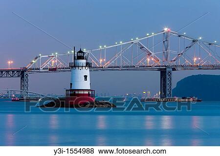 Twilight view of the Tarrytown Lighthouse and Tappan Zee Bridge on the Hudson River near the village of Sleepy Hollow, New York, with the skyline of Manhattan in New York City approximately 25 miles away in the background. View Large Photo Image Stock Photo - Twilight view of the Tarrytown Lighthouse and Tappan Zee Bridge on the Hudson River near the village of Sleepy Hollow, New York, with the skyline of Manhattan in New York City approximately 25 miles away in the background.. Fotosearch