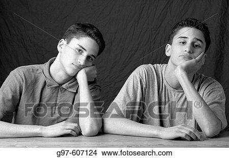 Twin brothers at table View Large Photo Image Picture - Twin brothers at table. Fotosearch
