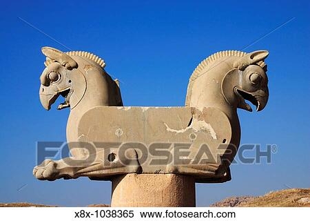 Stock Photography - Twin headed griffin-shaped capital at Persepolis archeology site, Iran. Fotosearch