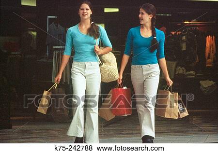 Twin sisters shopping View Large Photo Image Stock Photo - Twin sisters shopping. Fotosearch