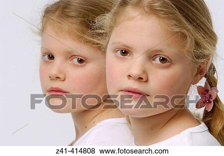 Stock Photo - Twin sisters. Fotosearch