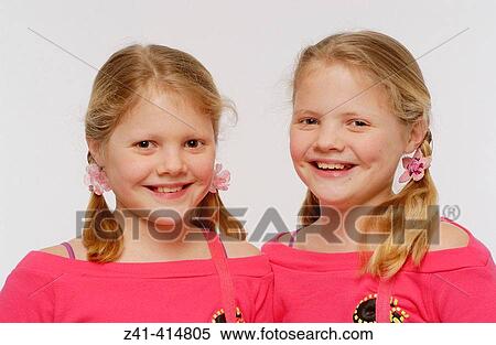 Stock Photography - Twin sisters. Fotosearch