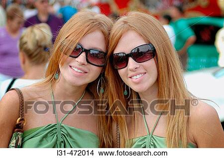 Twin Sisters who look alike and act alike as twins at the Twins gathering in Ohio. USA. View Large Photo Image Picture - Twin Sisters who look alike and act alike as twins at the Twins gathering in Ohio. USA.. Fotosearch