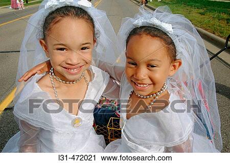 Twin Sisters who look alike and act alike as twins at the Twins gathering in Ohio. USA. View Large Photo Image Stock Image - Twin Sisters who look alike and act alike as twins at the Twins gathering in Ohio. USA.. Fotosearch