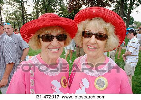 Twin Sisters who look alike and act alike as twins at the Twins gathering in Ohio. USA. View Large Photo Image Stock Photo - Twin Sisters who look alike and act alike as twins at the Twins gathering in Ohio. USA.. Fotosearch