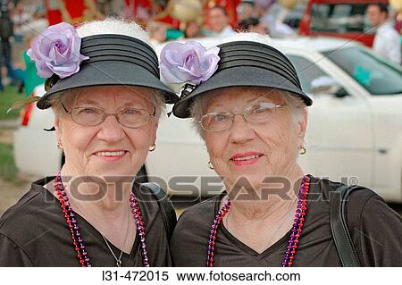Twin Sisters who look alike and act alike as twins at the Twins gathering in Ohio. USA. View Large Photo Image Stock Photography - Twin Sisters who look alike and act alike as twins at the Twins gathering in Ohio. USA.. Fotosearch