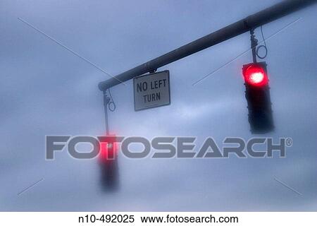 Twin traffic lights, on red, hanging over a city street View Large Photo Image Stock Photography - Twin traffic lights, on red, hanging over a city street. Fotosearch