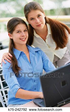 twins at a laptop View Large Photo Image Stock Image - twins at a laptop. Fotosearch