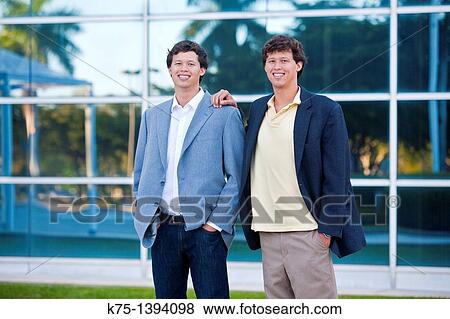 Twins outside office building View Large Photo Image Stock Photo - Twins outside office building. Fotosearch