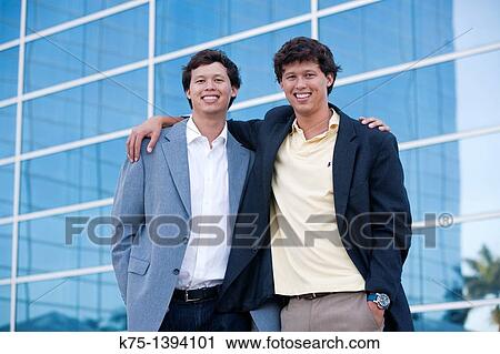 Twins portrait at office building View Large Photo Image Stock Image - Twins portrait at office building. Fotosearch