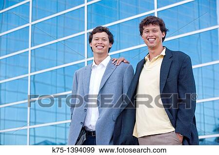 Twins portrait outside office building View Large Photo Image Stock Photo - Twins portrait outside office building. Fotosearch