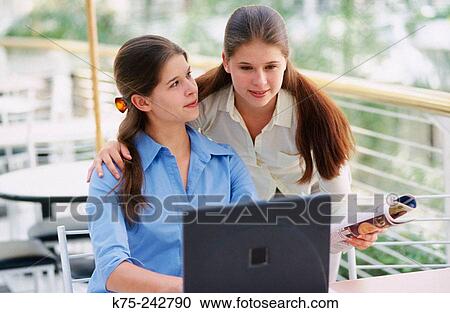 Twins using a computer View Large Photo Image Stock Image - Twins using a computer. Fotosearch