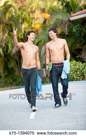 Twins walking home after skateboarding View Large Photo Image Stock Photography - Twins walking home after skateboarding. Fotosearch