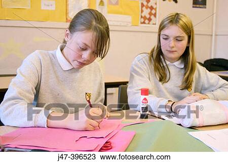 Two 12 year old girls sitting in class, drawing View Large Photo Image Stock Image - Two 12 year old girls sitting in class, drawing. Fotosearch